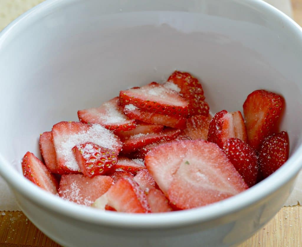 Strawberry and Cream Napoleon Recipe preparing the strawberries with sugar